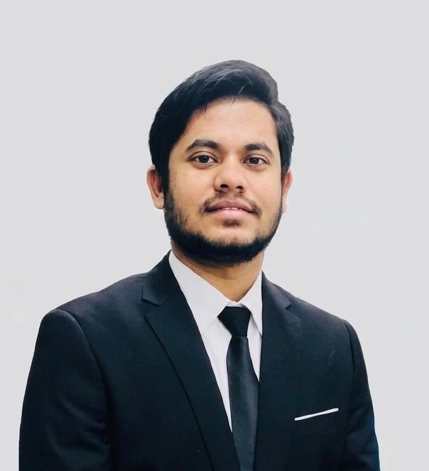 MD LUMAN JAMALI in a dark suit and tie